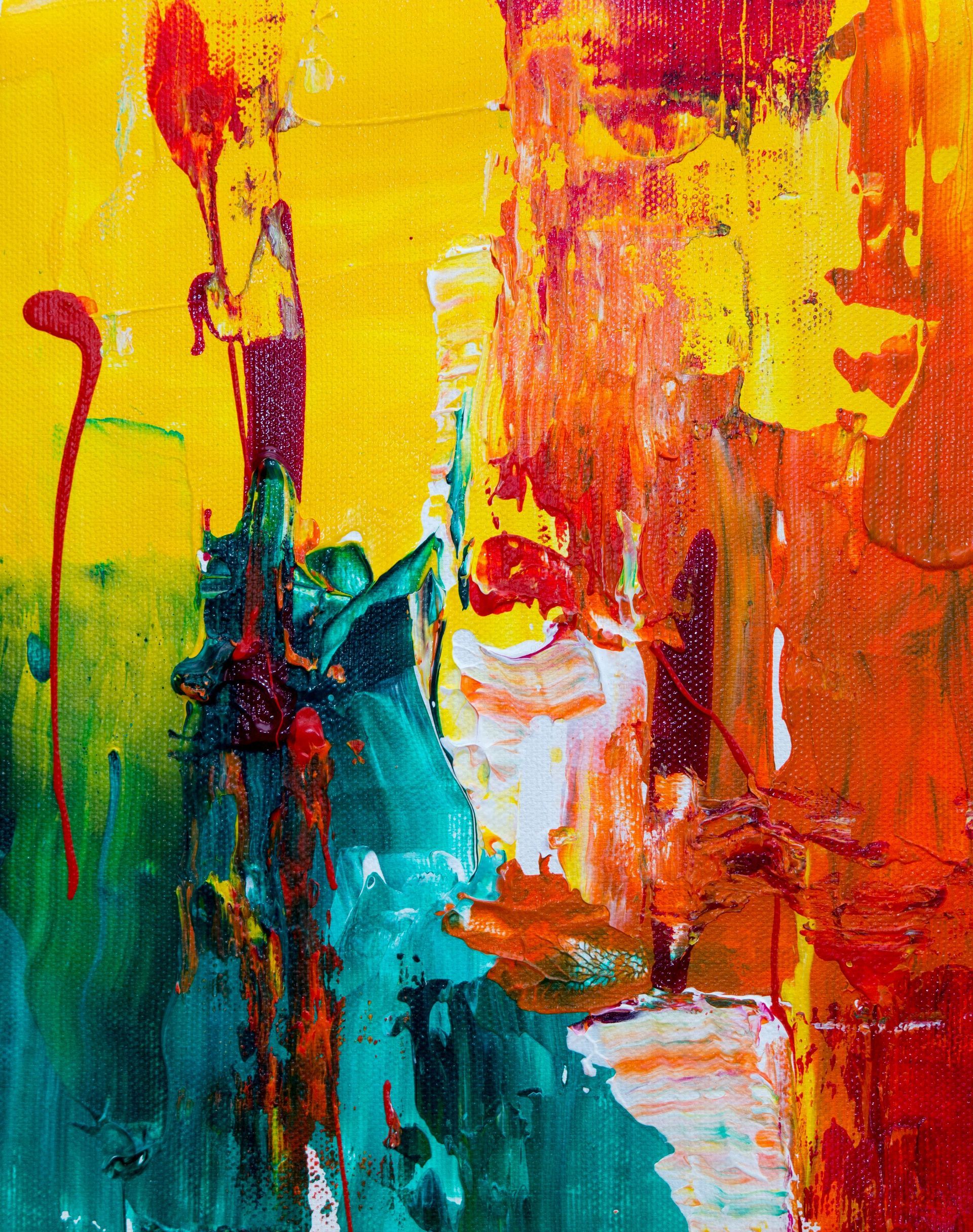Abstract art with vibrant colors; yellow, red, orange, green, and white. Splashes and brushstrokes create an energetic composition.