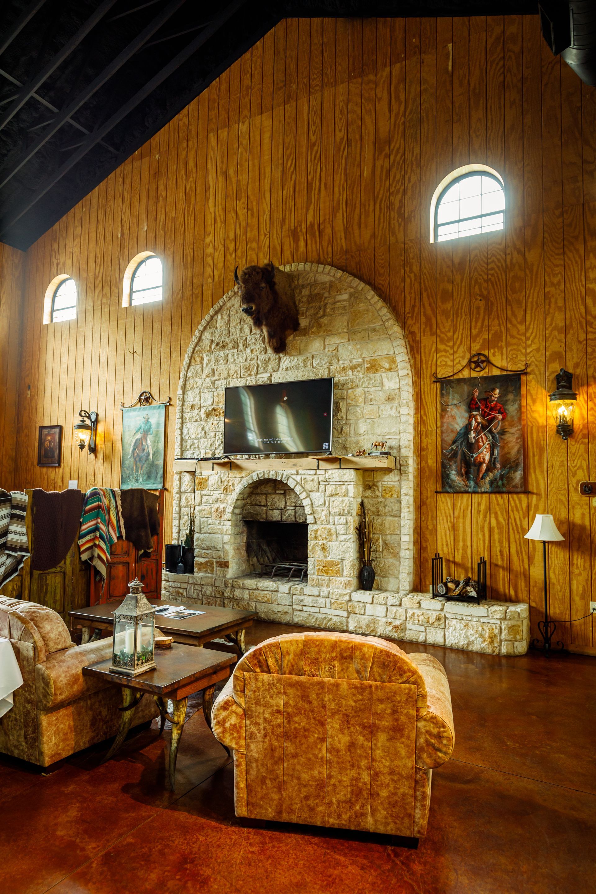 A living room with a fireplace and a flat screen tv.