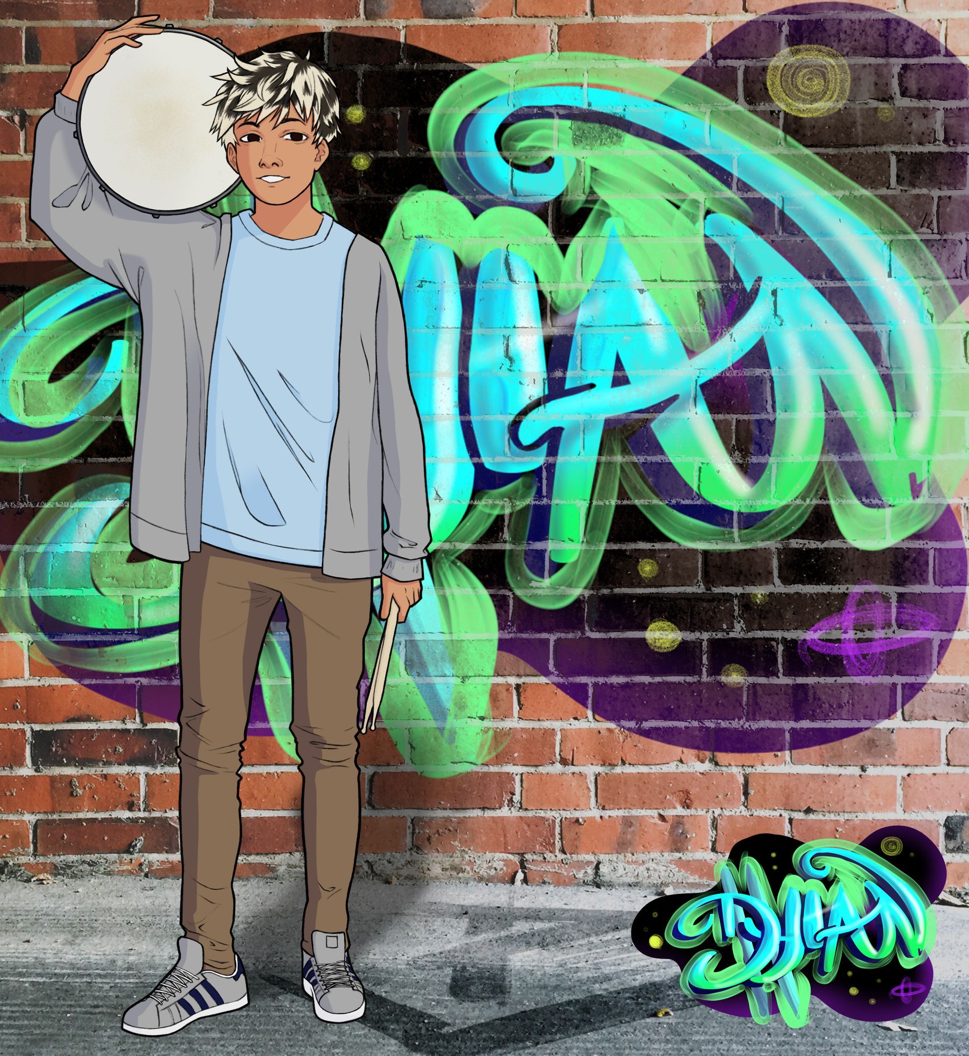 A boy is standing in front of a graffiti wall holding a drum