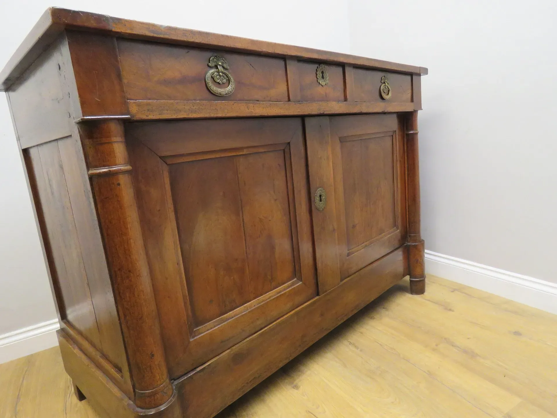 A fine quality Early 19th century French Walnut 2 Door Side Cabinet complete with original fittings and having excellent patination. 2