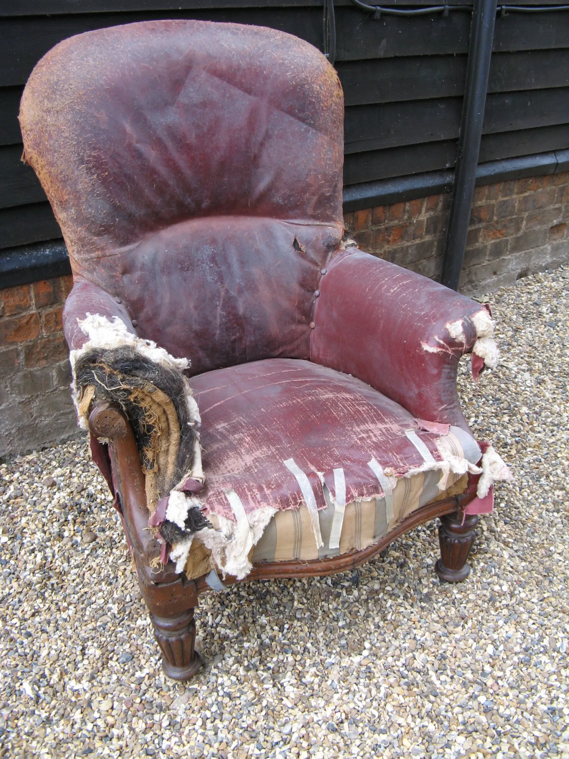 A very large mid Victorian oak framed gentleman's spoon back armchair with bags of potential. 1