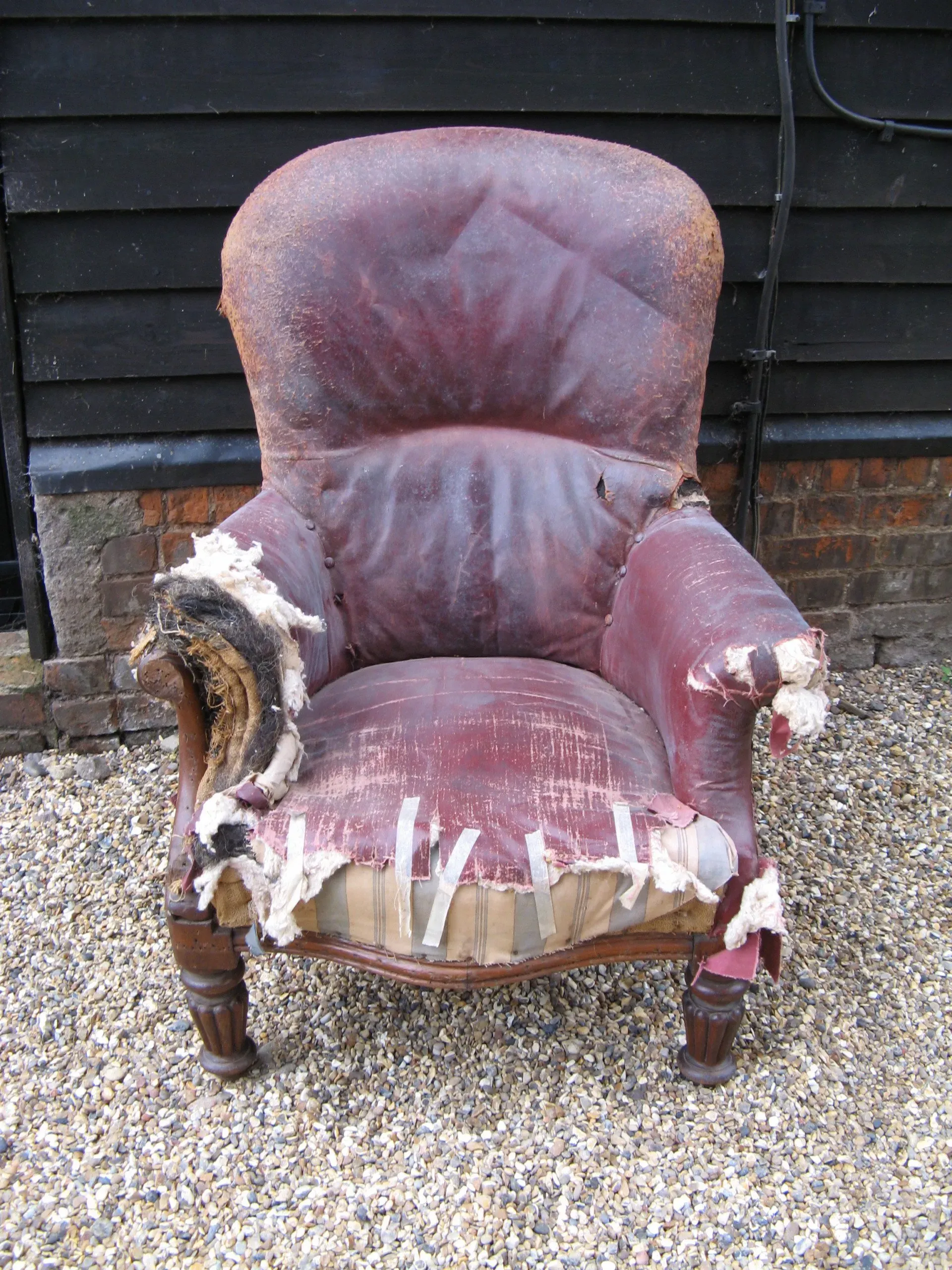A very large mid Victorian oak framed gentleman's spoon back armchair with bags of potential. 2
