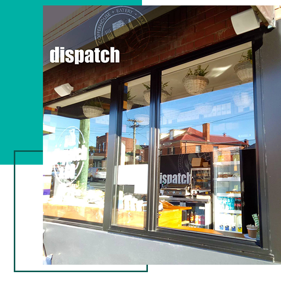 A picture of a window with the word dispatch on it A picture of a window with the word dispatch on it
