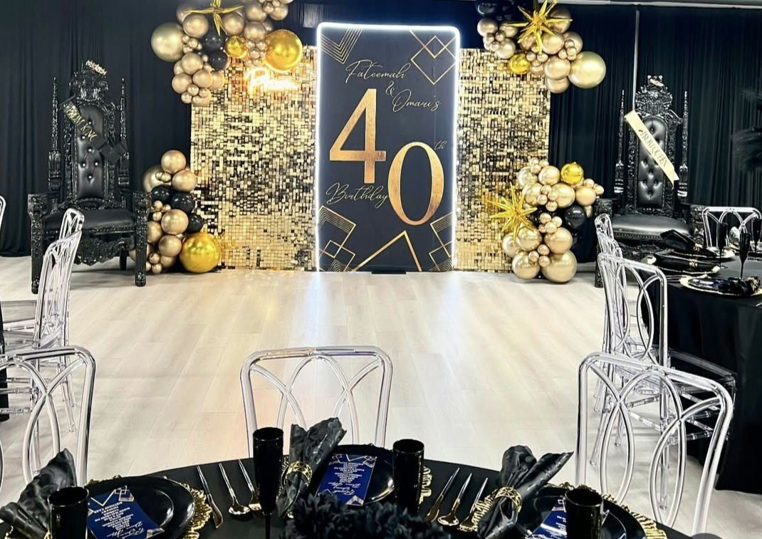 A table and chairs are set up for a 40th birthday party.