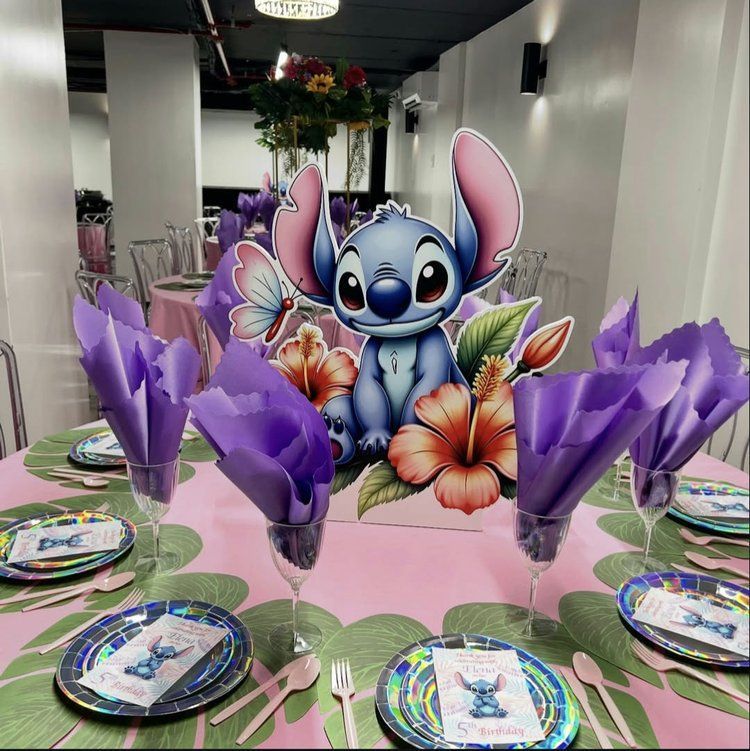 A table set for a party with a stitch centerpiece