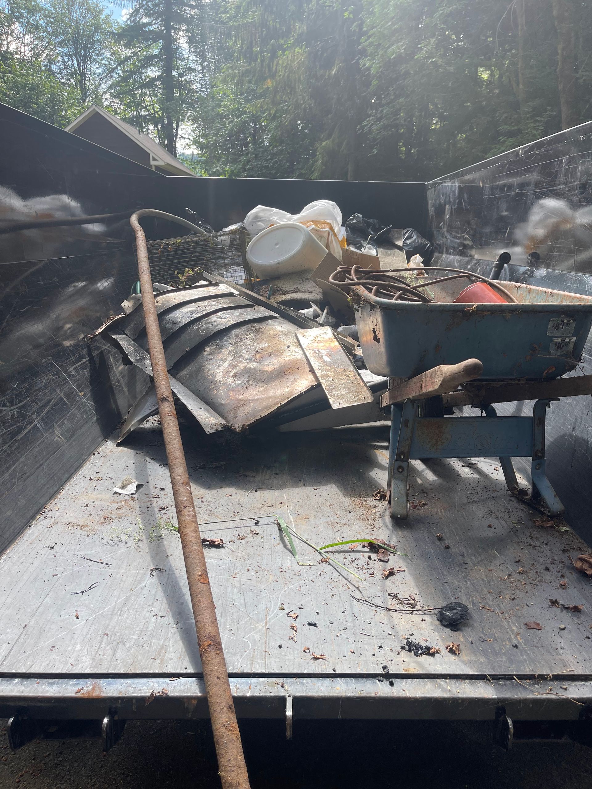 Dumpster filled with trash and debris.