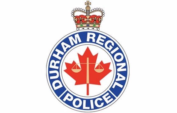 A logo for the durham regional police with a maple leaf and scales of justice