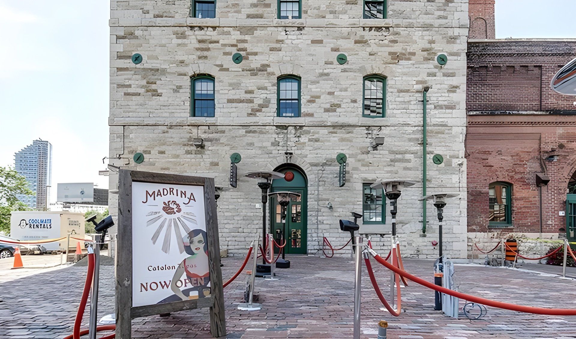 A brick building with a sign in front of it that says ' hippie ' on it