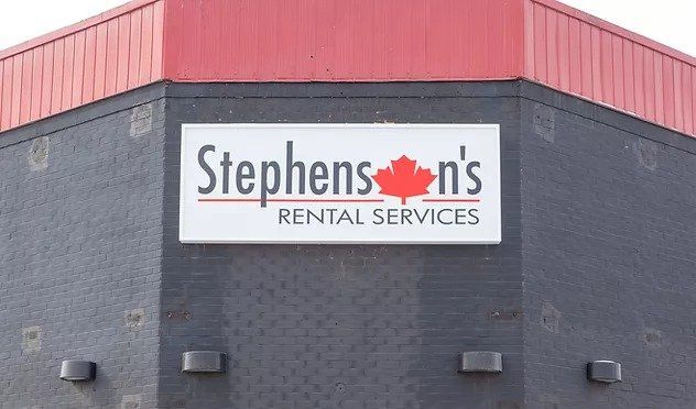A sign on the side of a building that says stephen 's rental services