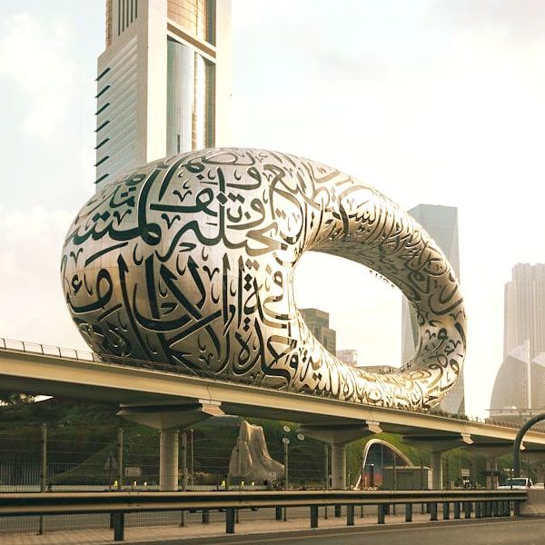 A large sculpture with arabic writing on it