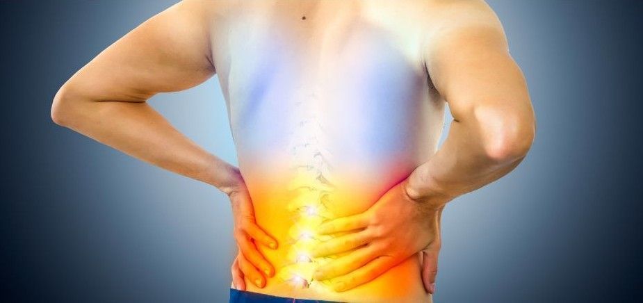 A person’s back is highlighted in orange and yellow, indicating lower back pain, against a blue background.