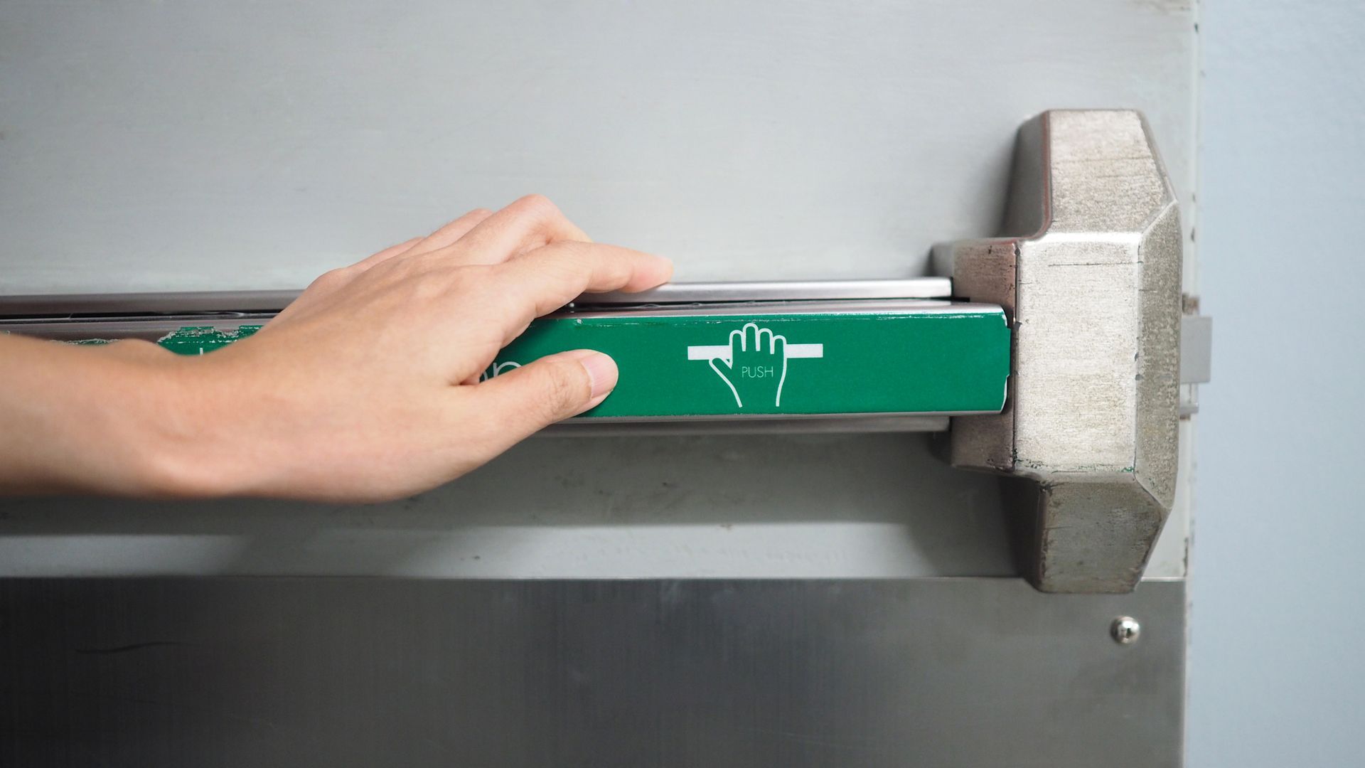 Fire door handle of fire exit for emergency evacuation. Fire door handle of fire exit for emergency evacuation.