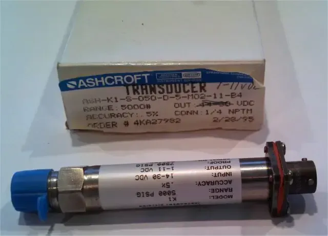 Blue-and-silver cylindrical transducer with boxed packaging behind it on a white surface