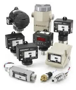 Assorted industrial sensors and control devices in black, beige, and metallic finishes on a white background