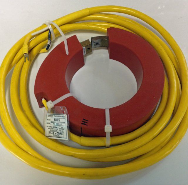 Red current transformer ring with yellow coiled cable and white zip ties