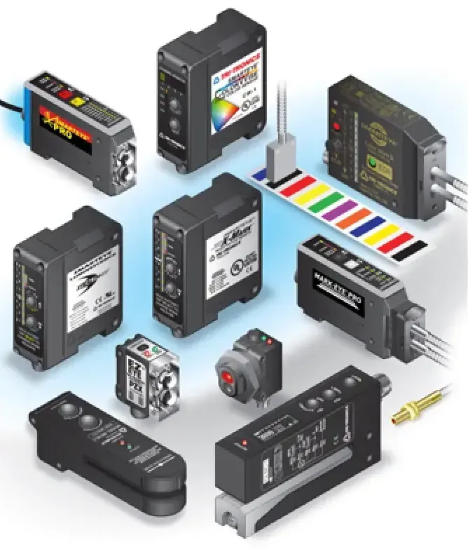 Assorted electronic sensors and industrial control modules arranged on a white background with color test strips