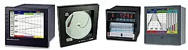 Four industrial control panels and monitors with charts, gauges, and digital displays on dark frames