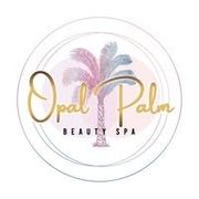 Logo for Opal Palm Beauty Spa, featuring a watercolor palm tree in pink and blue, encircled by gold text on a white background.