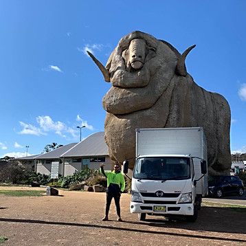 moving truck parked in front of The Big Merino