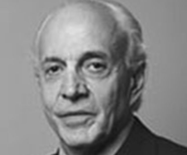 a black and white photo of a man in a suit and tie