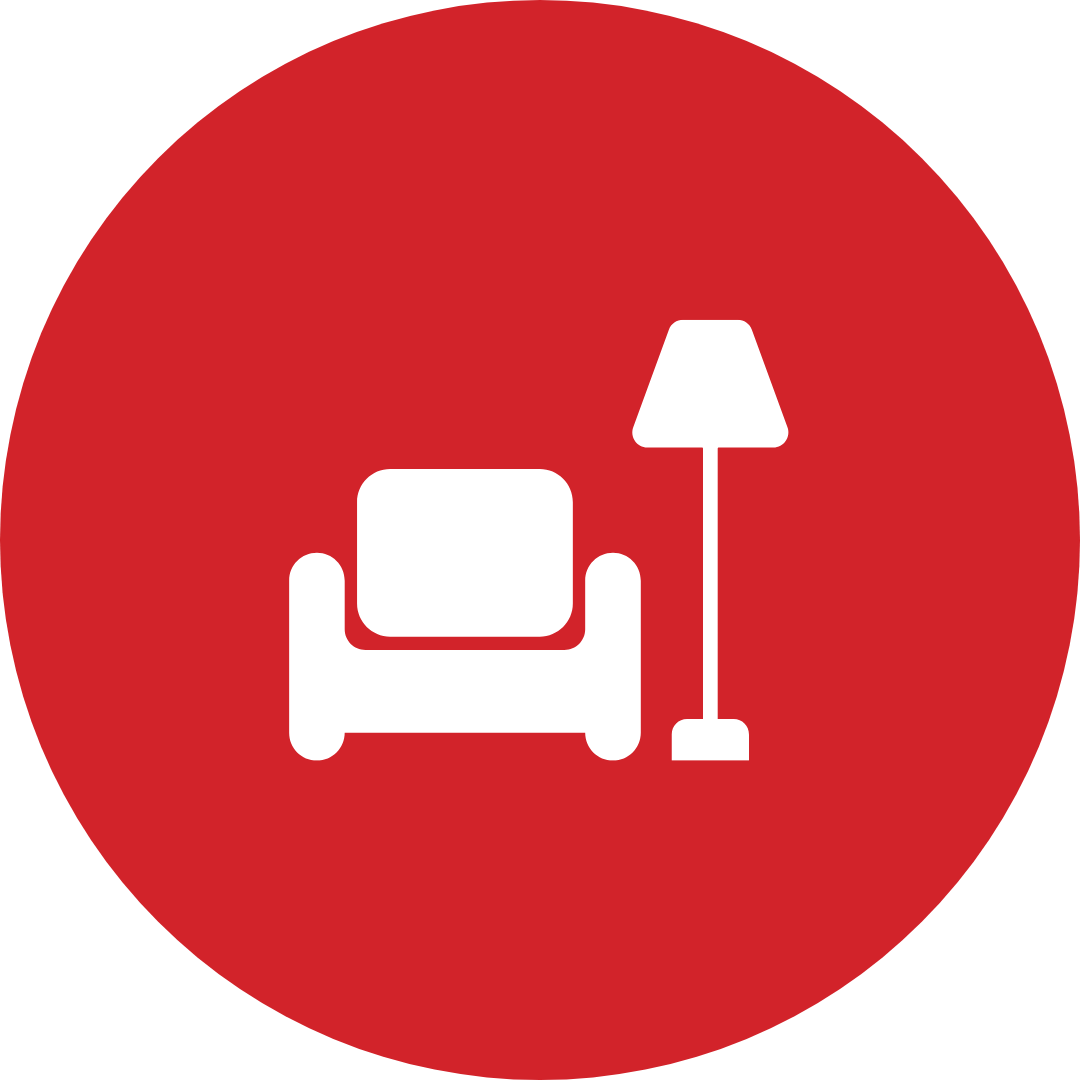 A red circle with a chair and lamp inside of it.