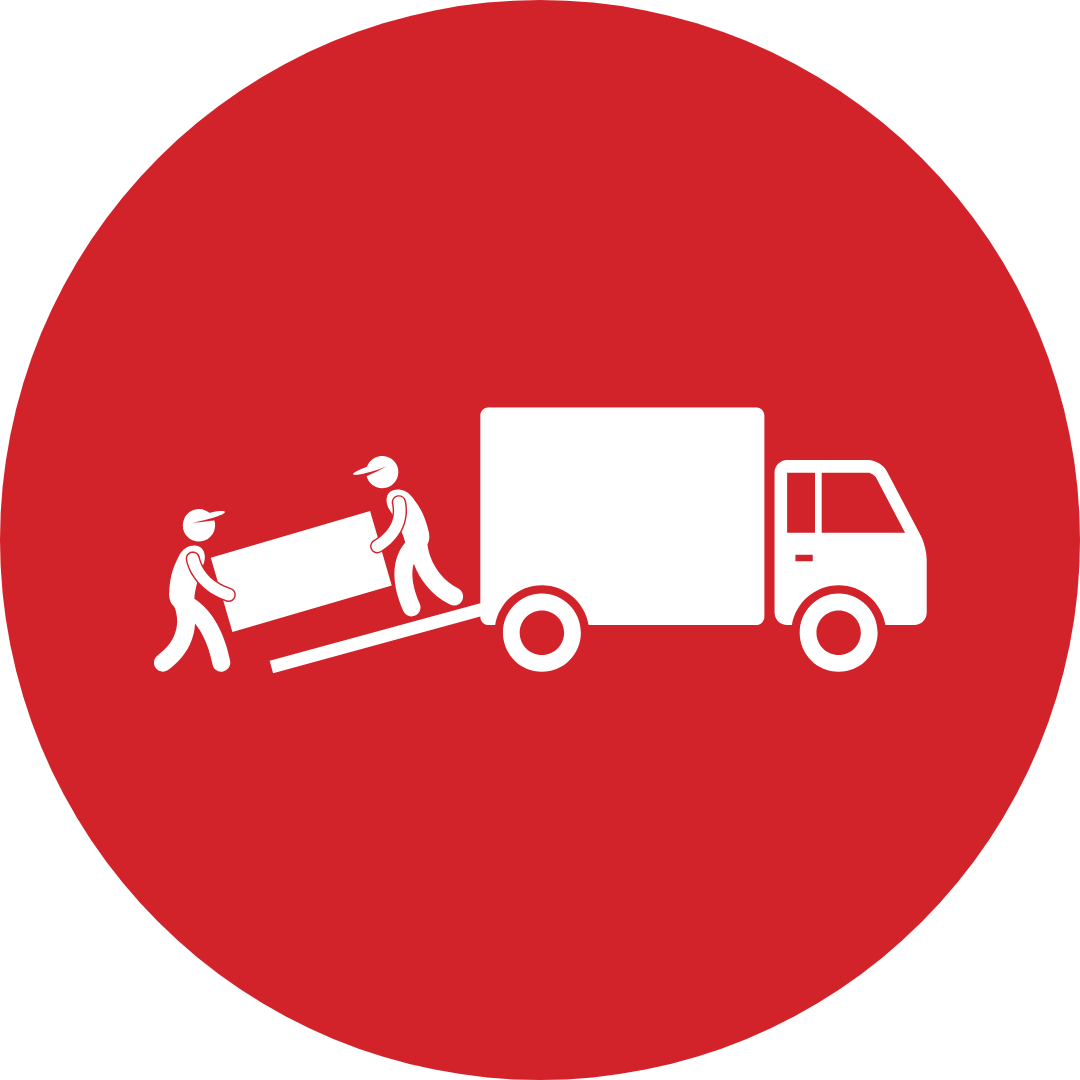Two men are pushing a large piece of furniture into a truck.