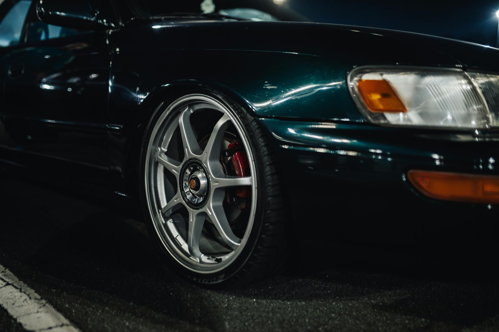 Close-up of an Orange Car Wheel Spinning on a Dyno — Edmonton Tyre and Mechanical Services in Edmonton, QLD