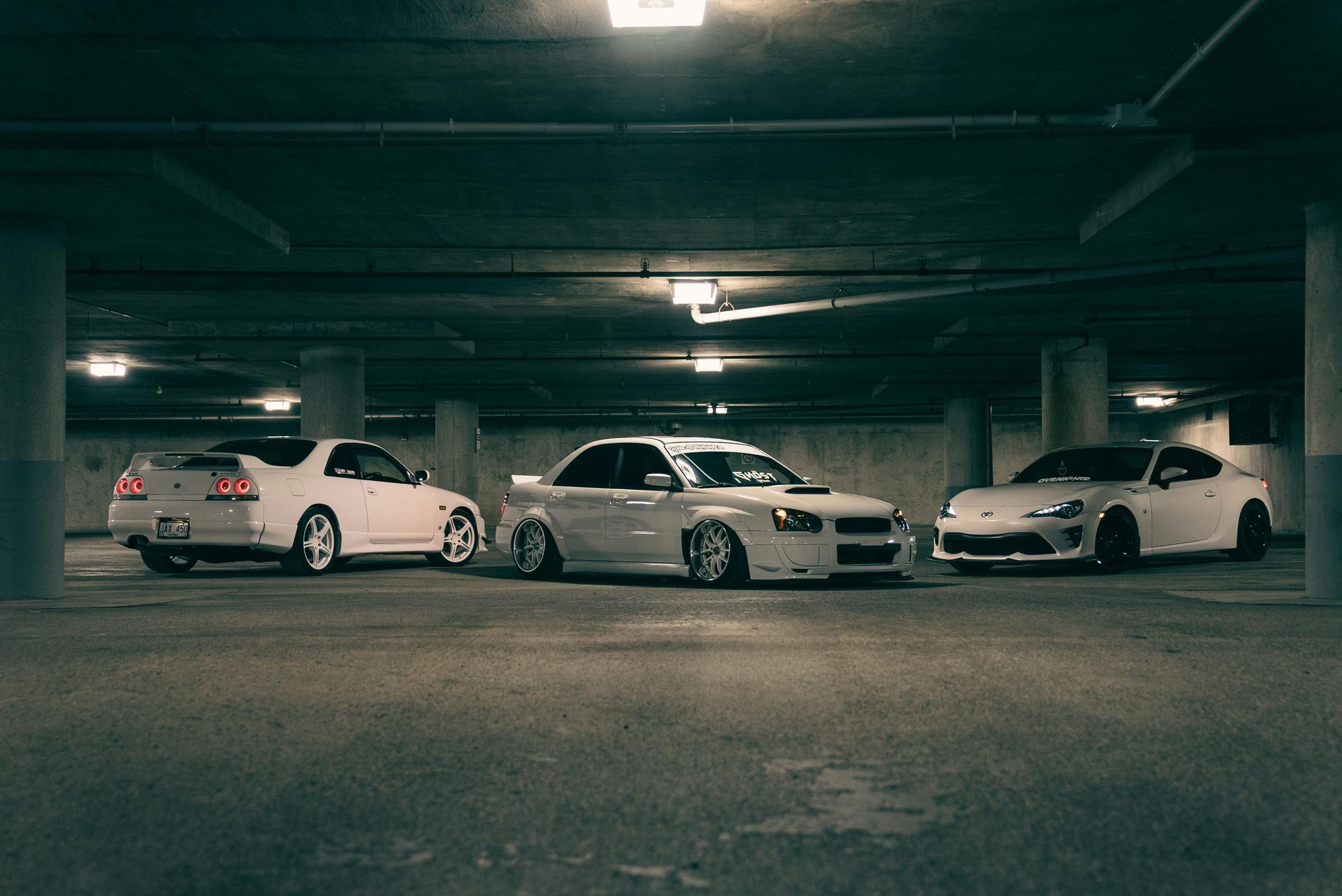 Car Tyre  With Alignment Equipment on a Lift, in a Garage — Edmonton Tyre and Mechanical Services in Edmonton, QLD
