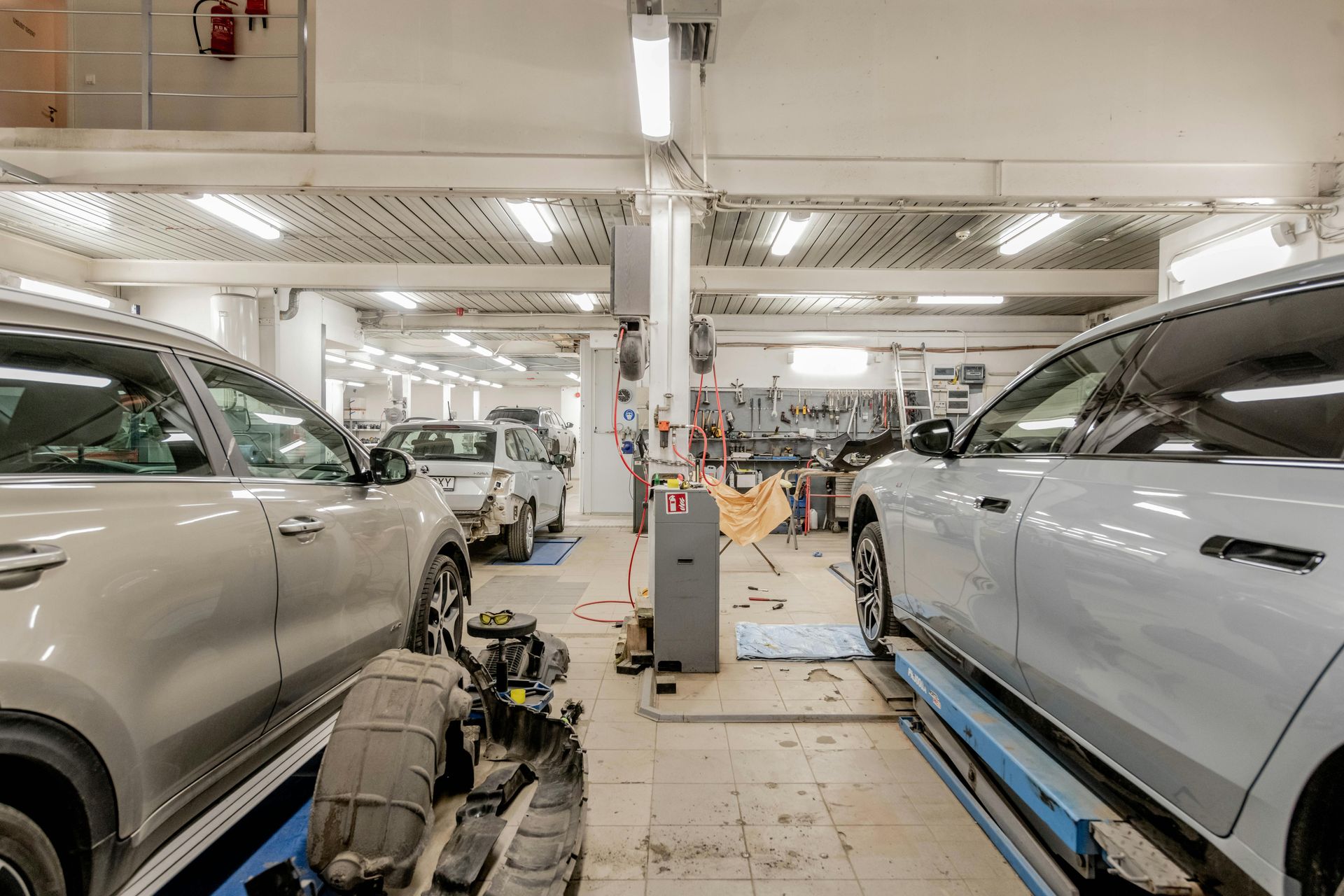 Truck inspector checking tire with clipboard — Edmonton Tyre and Mechanical Services in Edmonton, QLD