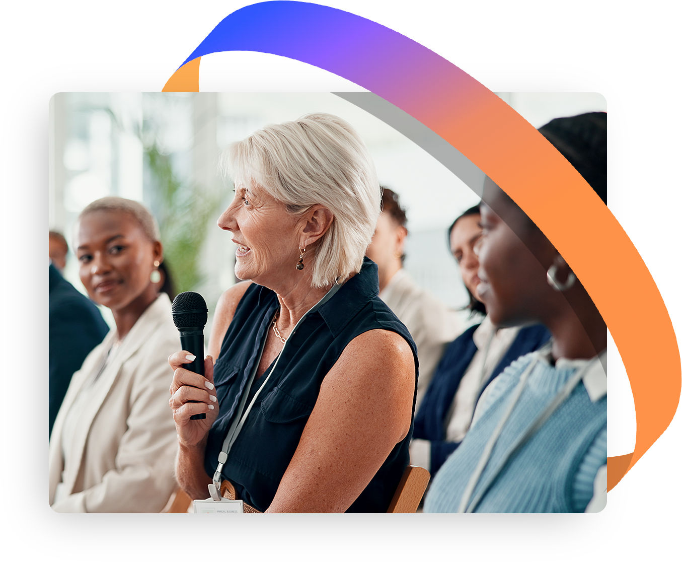 Woman asks a question in a conference-like setting