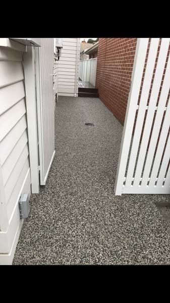 concrete walkway with fence