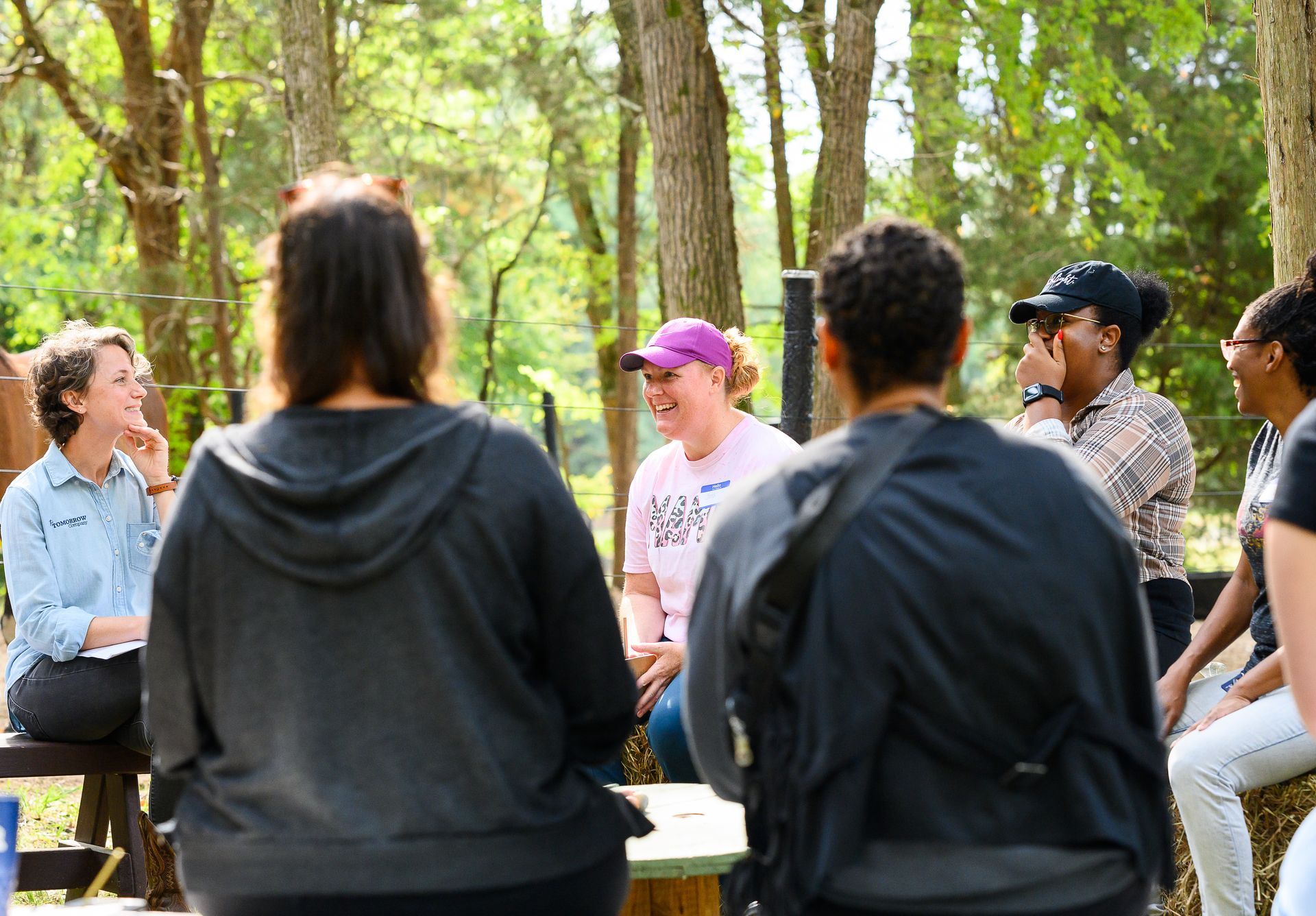 A man and a child are playing with toys on the floor.