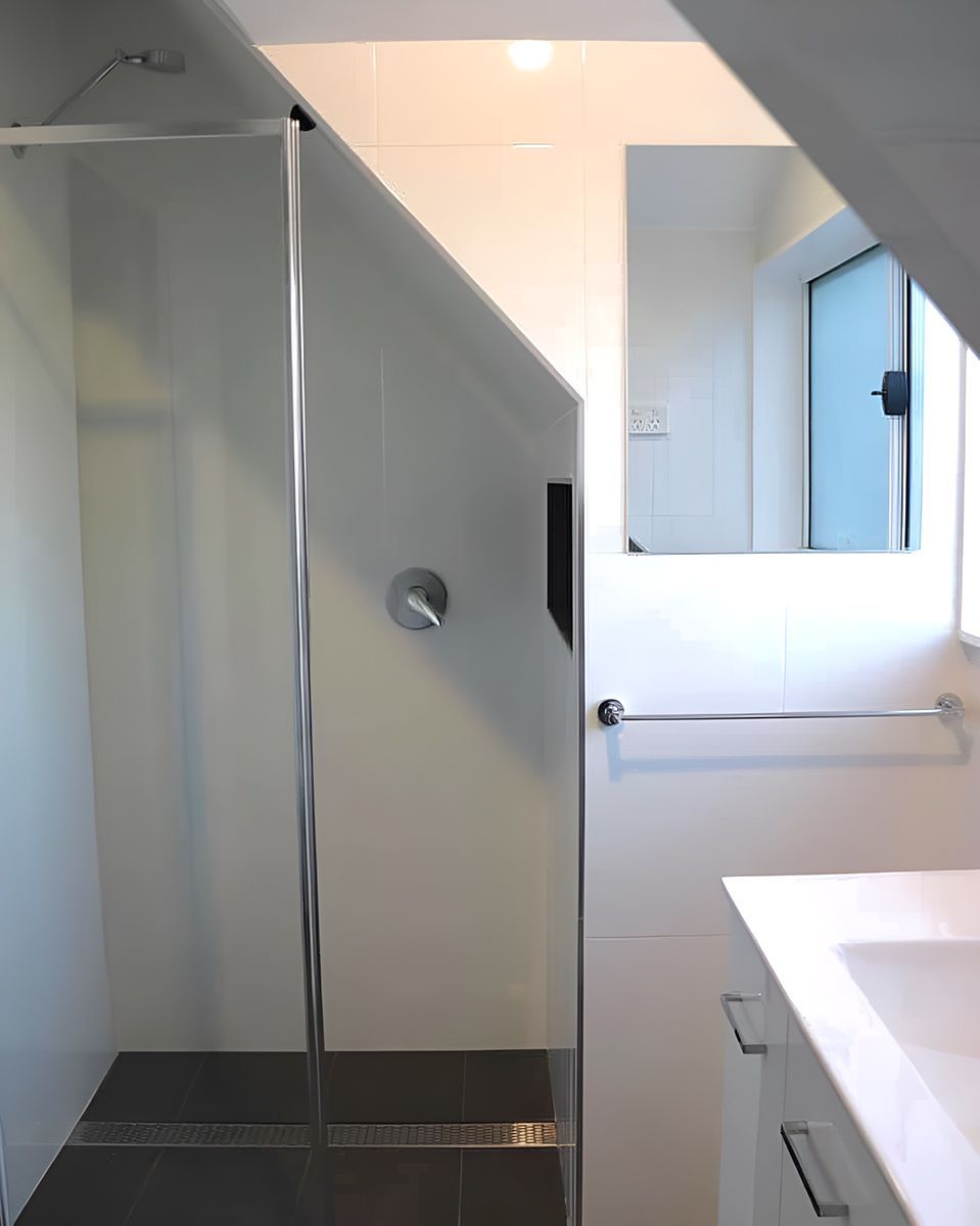 White Bathroom Featuring a Glass-enclosed Shower — Piscopo Kitchens Plus In Forster, NSW