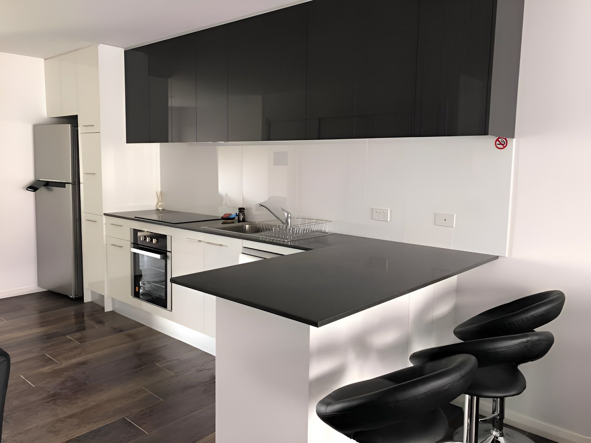 Modern Kitchen With Black Countertops — Piscopo Kitchens Plus In Forster, NSW