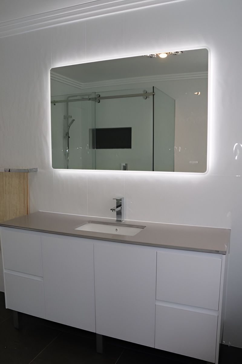 Bathroom With a Backlit Mirror — Piscopo Kitchens Plus In Hallidays Point, NSW