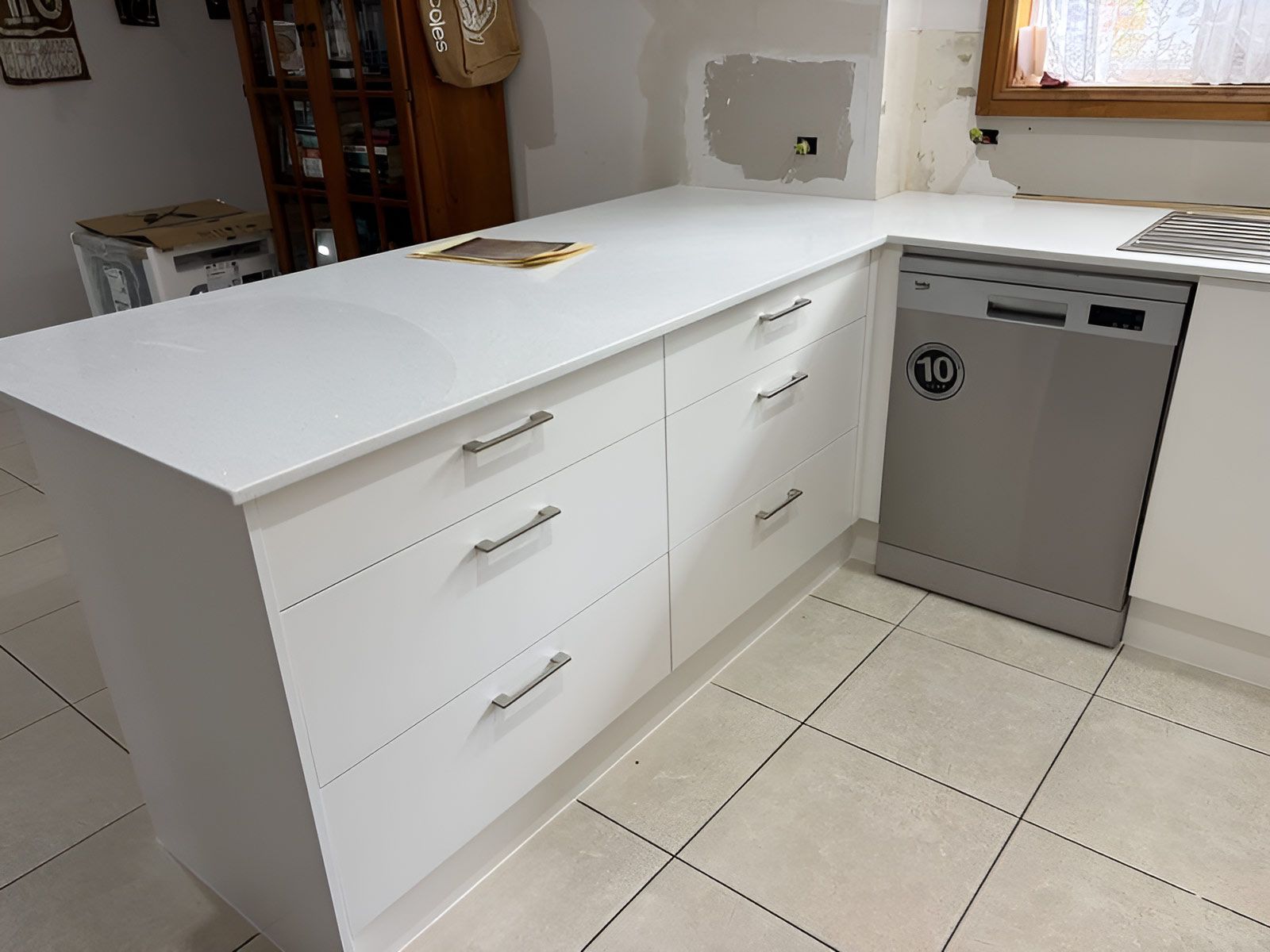 Kitchen With White Cabinets and a Silver Dishwasher — Piscopo Kitchens Plus In Forster, NSW