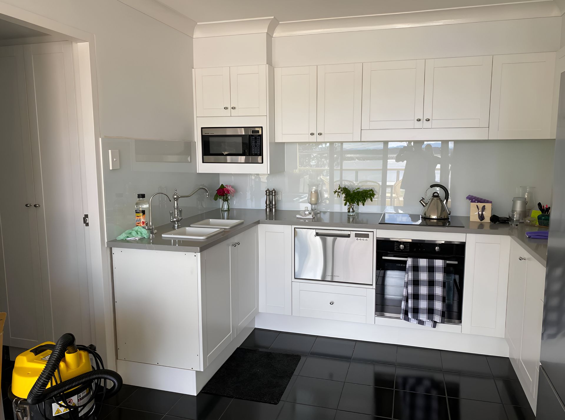 Modern Kitchen With Black Tile Flooring — Piscopo Kitchens Plus In Taree, NSW