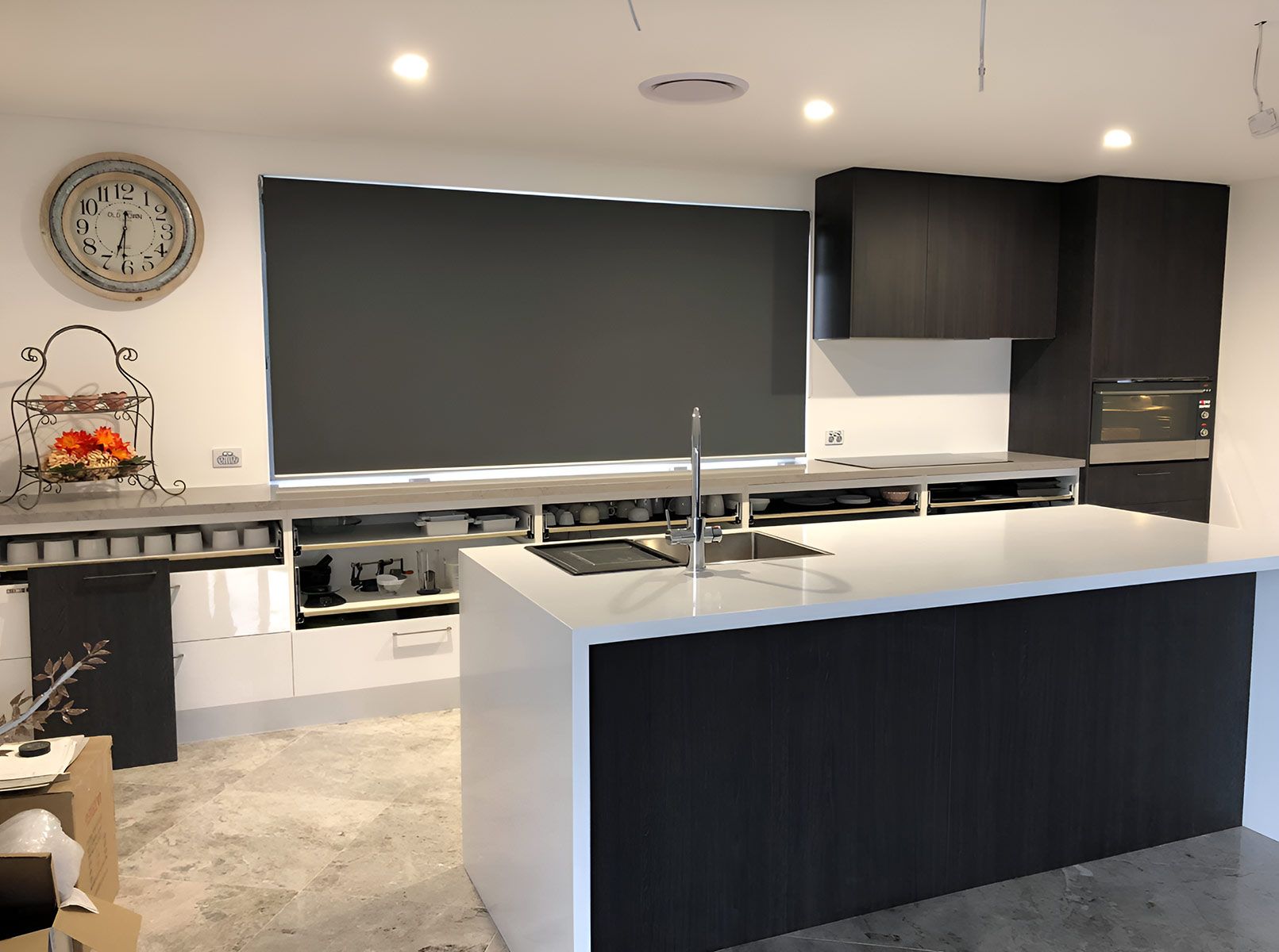 A Kitchen With a Large Island, Sleek Dark Cabinets — Piscopo Kitchens Plus In Tuncurry, NSW