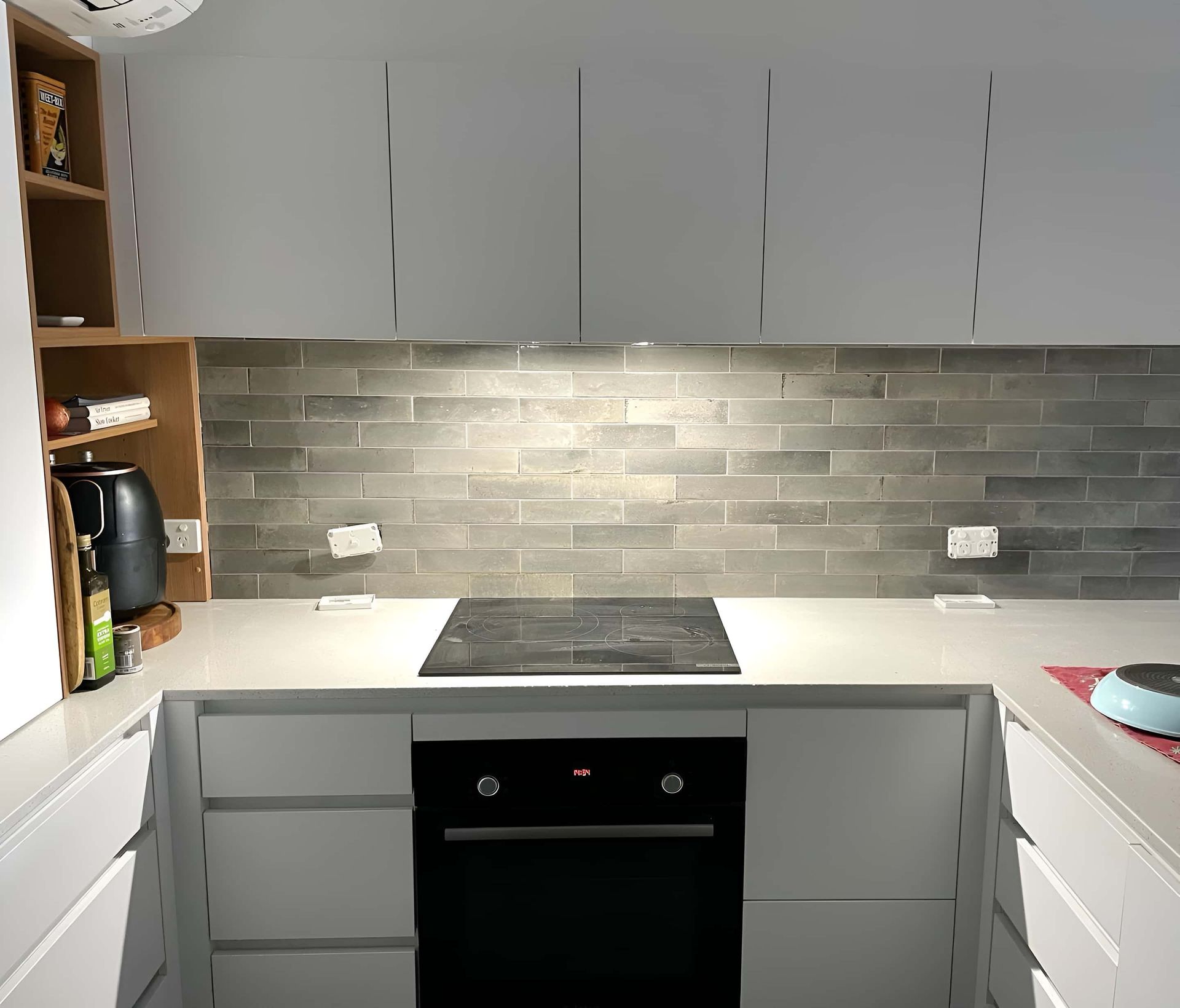 Modern Kitchen With Sleek White Cabinets — Piscopo Kitchens Plus In Forster, NSW