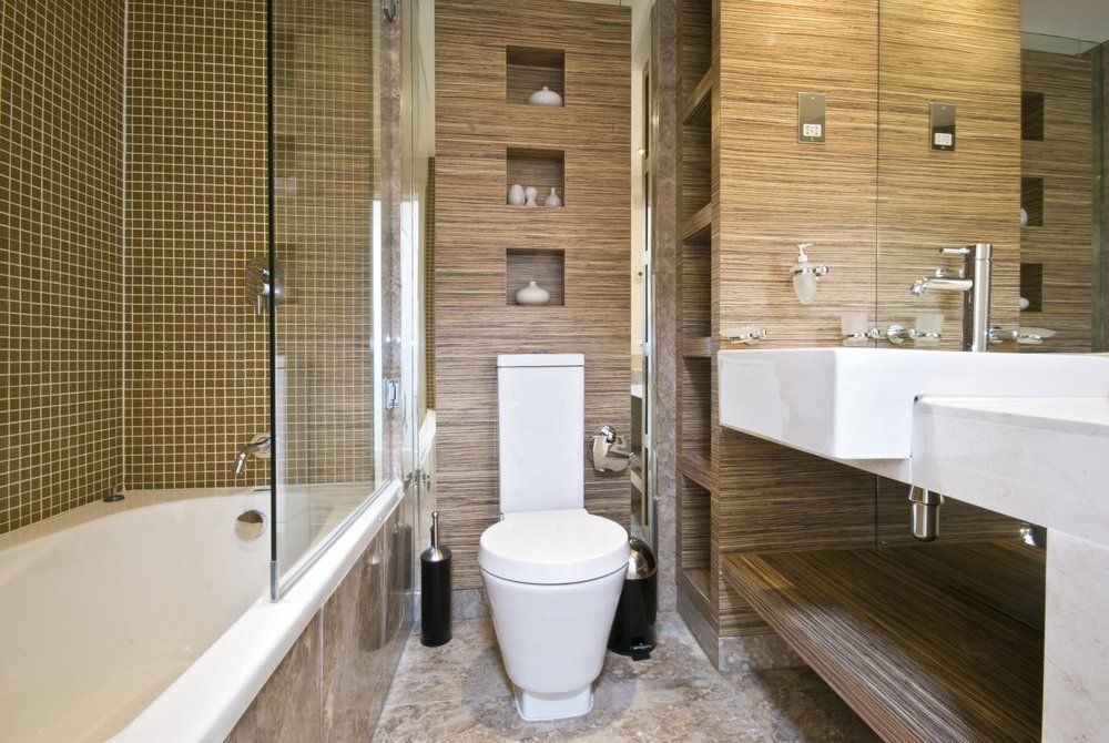 Toilet sink and shower in modern bathroom