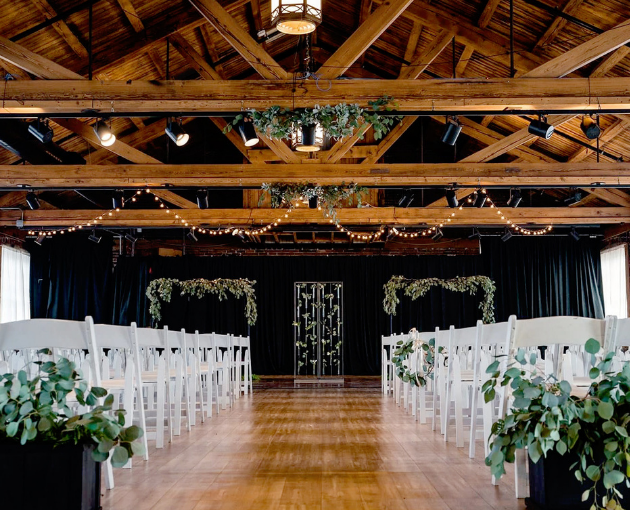 wedding ceremony in historic venue with exposed beams