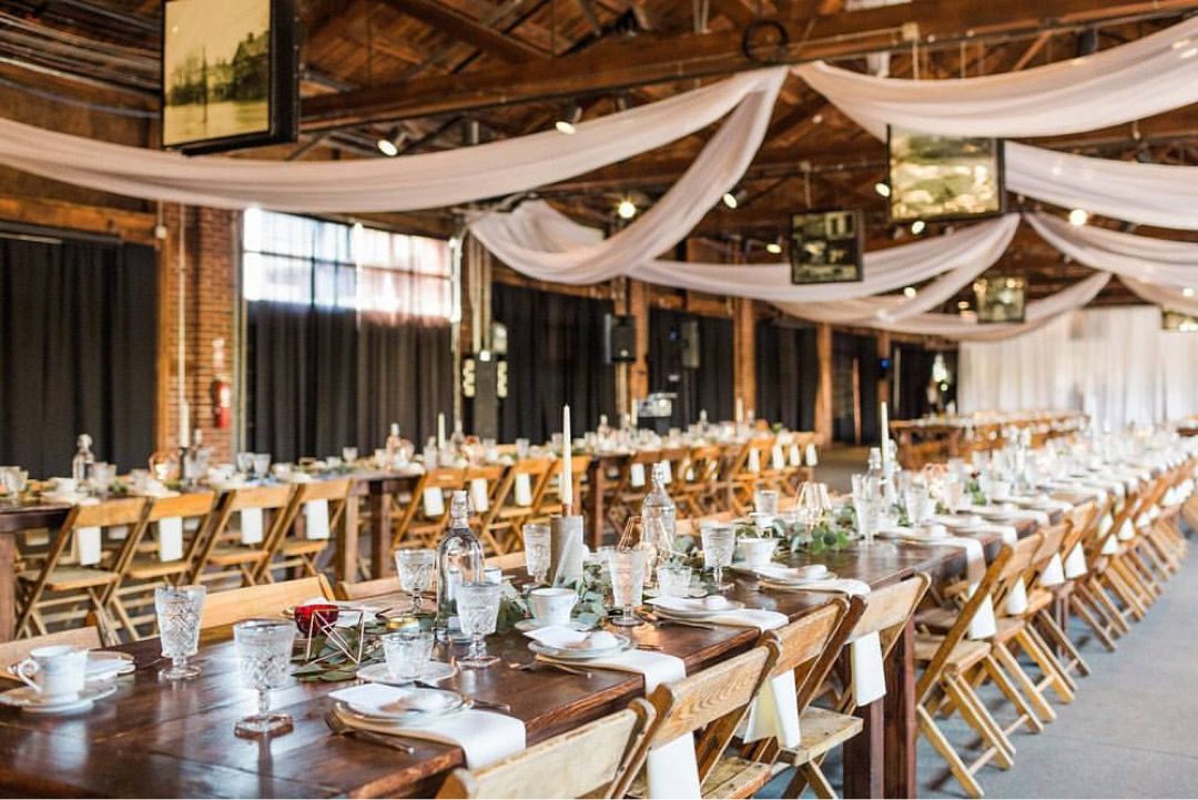 long wooden tables at wedding receptoion