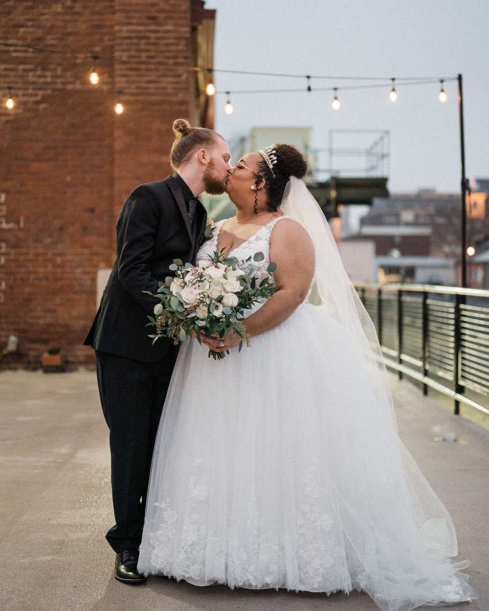 bride and groom kissing