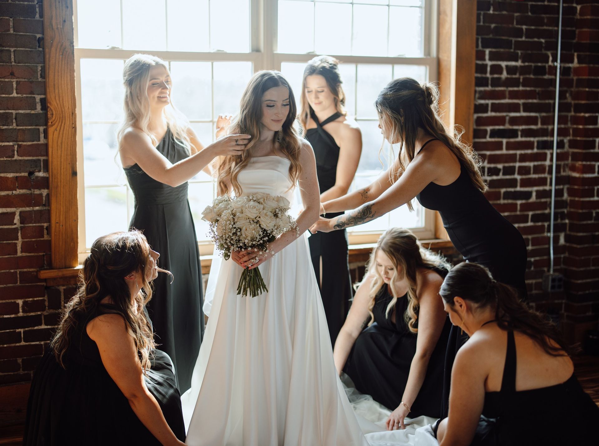 bride surrounded by bridesmaids