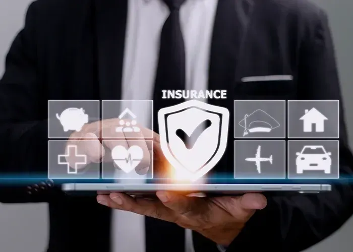 Texas business owner calculating long-term savings from business insurance