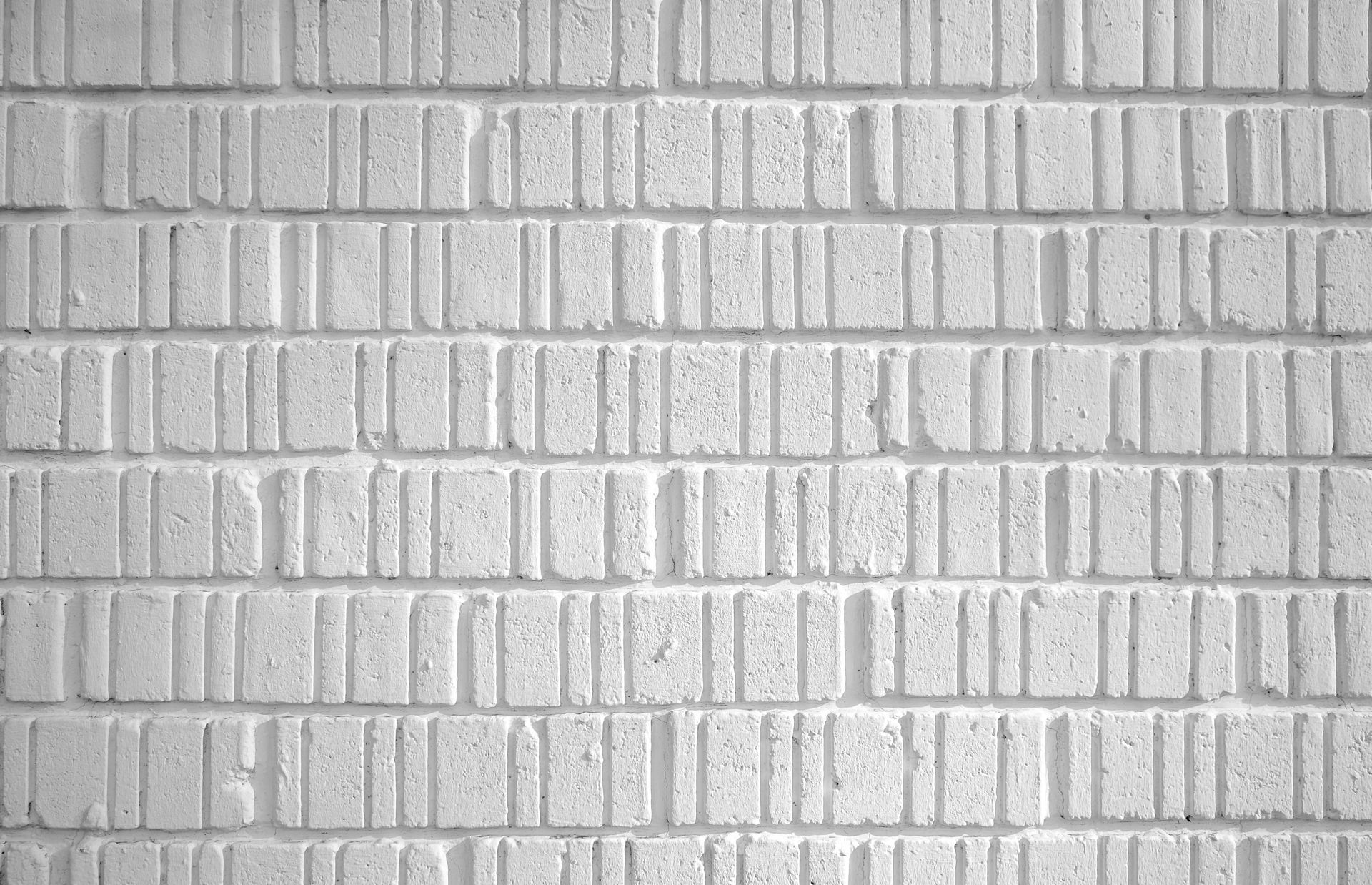 A close up of a white brick wall with a diagonal pattern.