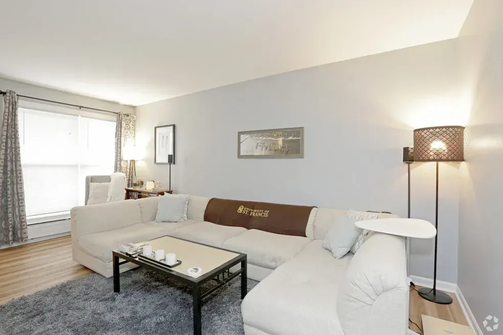 A living room with a couch and a coffee table