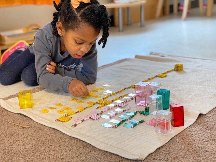 Montessori child working with materials