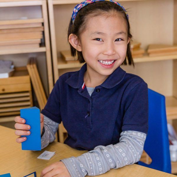 Montessori child with materials