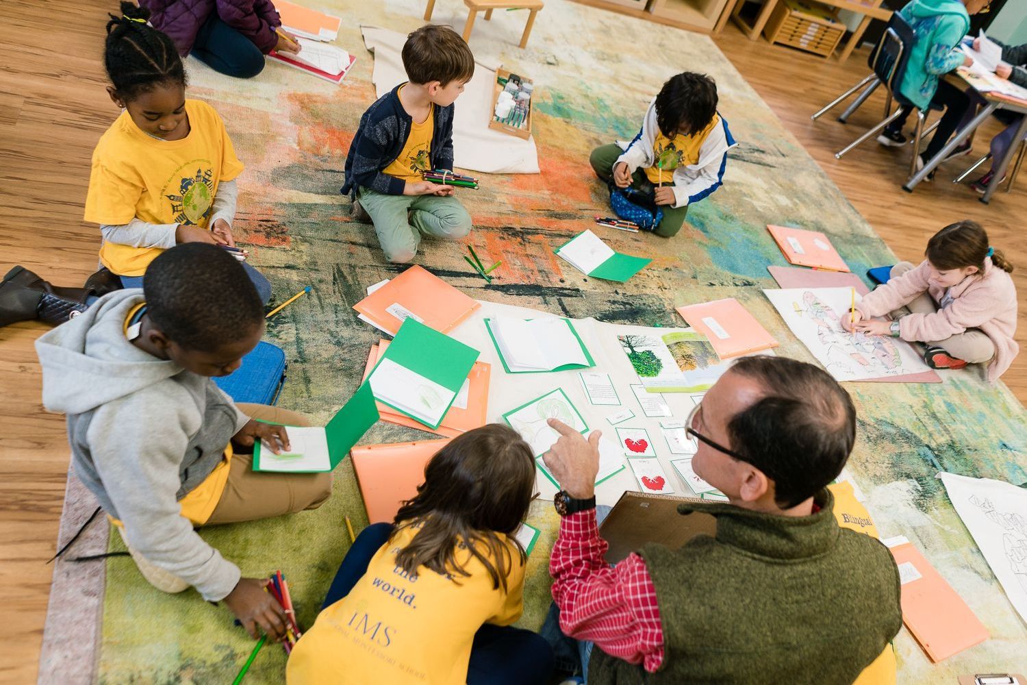 Montessori guide working with children